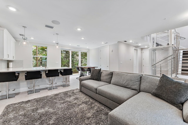 living room with ornamental molding