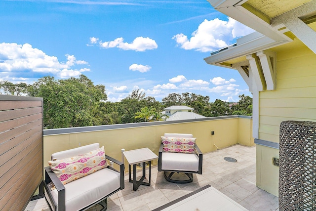 view of patio featuring a balcony