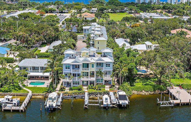 birds eye view of property with a water view