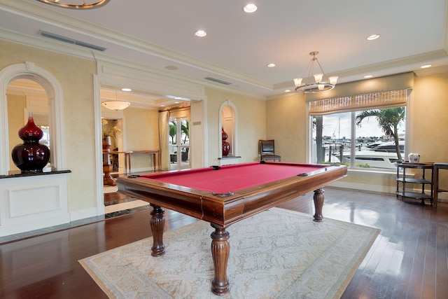 game room featuring billiards, ornamental molding, dark hardwood / wood-style flooring, and a tray ceiling