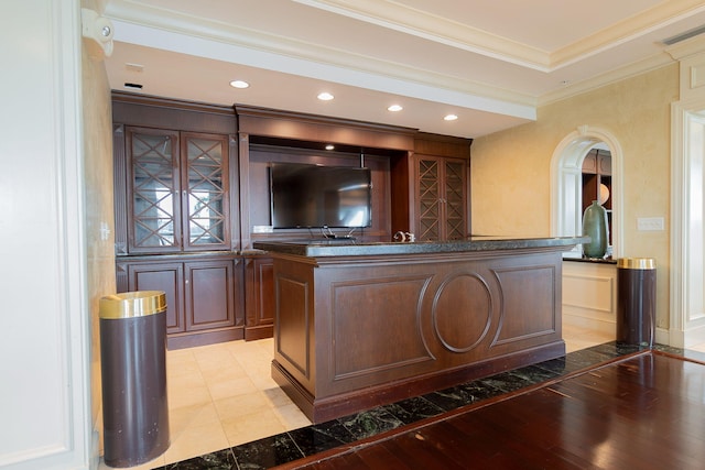 bar with crown molding and light hardwood / wood-style flooring