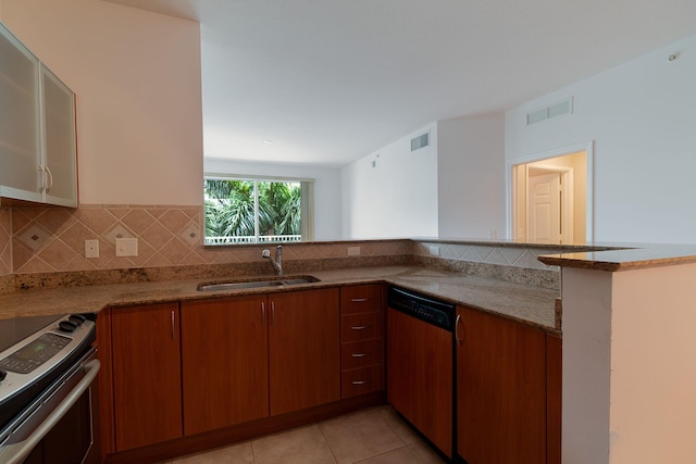 kitchen featuring kitchen peninsula, stainless steel dishwasher, light stone counters, sink, and range with electric stovetop