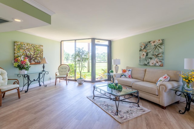 living room with light hardwood / wood-style flooring, a wall of windows, and ornamental molding