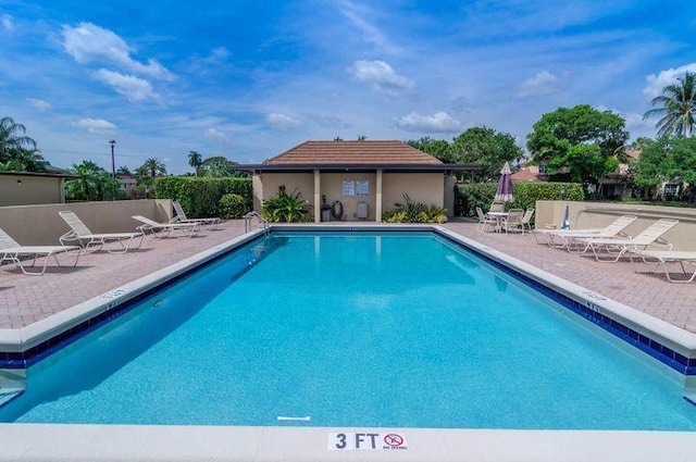 view of swimming pool with a patio area