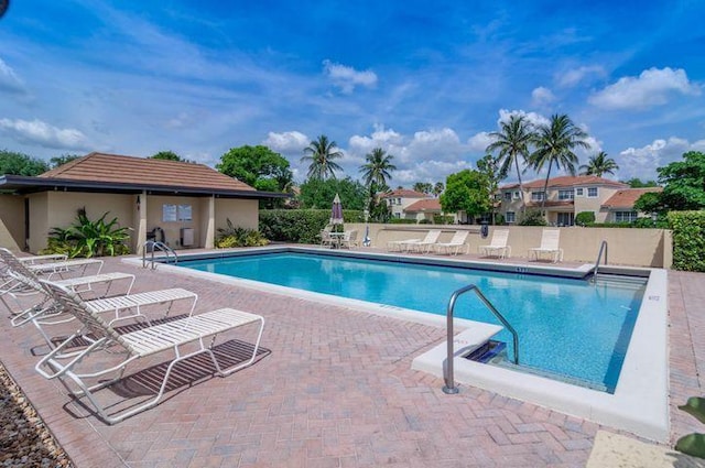 view of swimming pool with a patio area