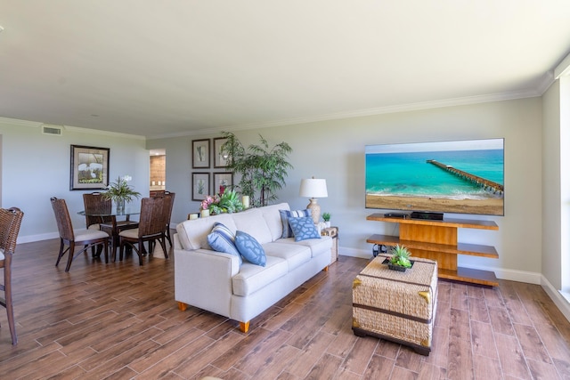 living room featuring hardwood / wood-style floors and ornamental molding