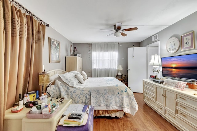 bedroom featuring ceiling fan and light hardwood / wood-style floors