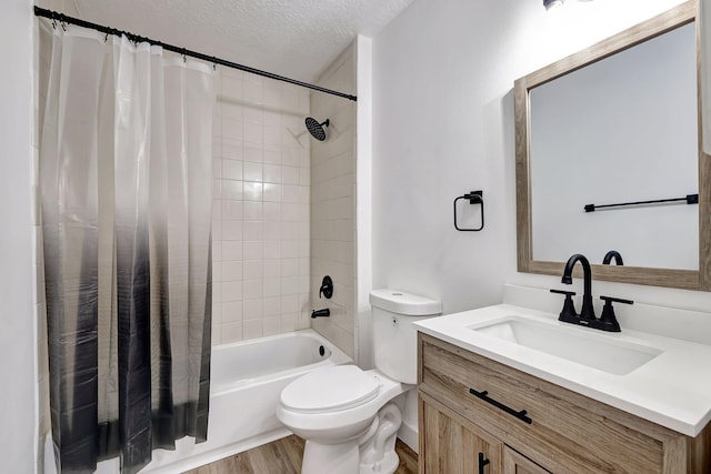 full bathroom featuring a textured ceiling, toilet, vanity, shower / tub combo, and hardwood / wood-style flooring