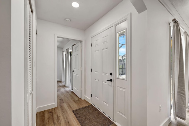 entryway with light hardwood / wood-style floors