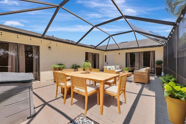 view of patio / terrace featuring an outdoor living space and glass enclosure