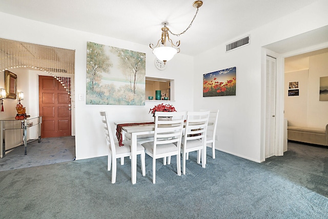 view of carpeted dining space