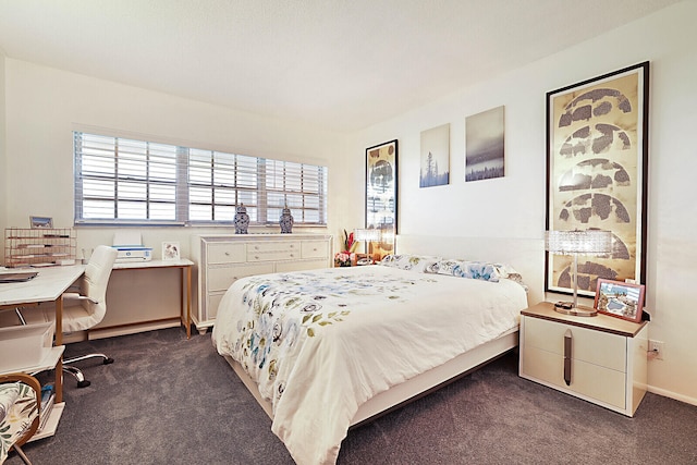 bedroom featuring dark colored carpet