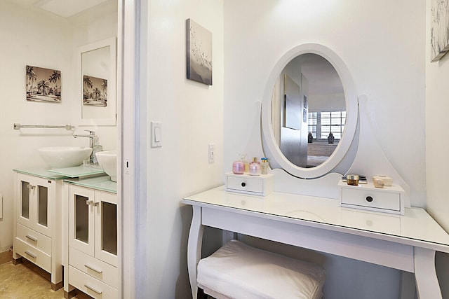 bathroom featuring tile patterned flooring and vanity