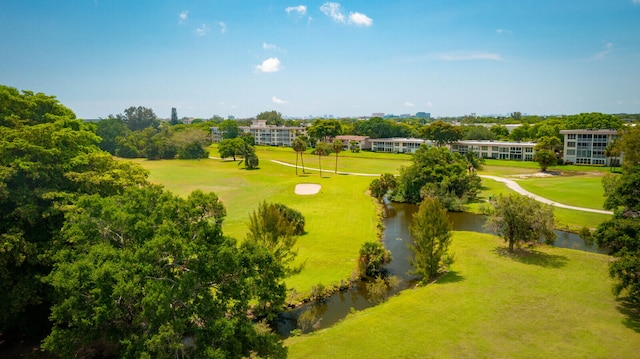 surrounding community featuring a yard and a water view