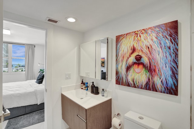 bathroom with vanity and toilet