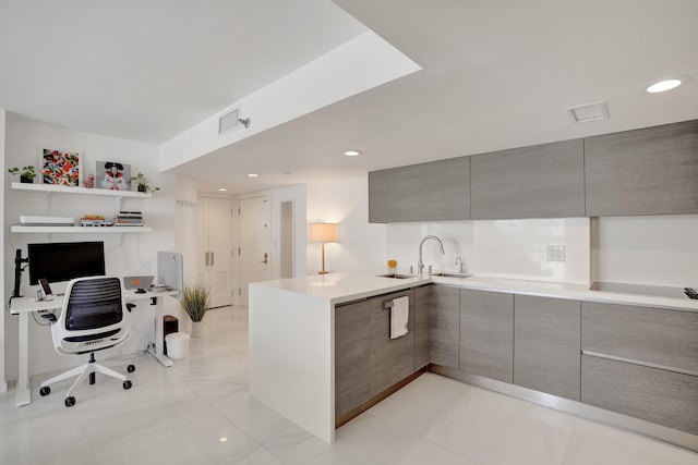 kitchen with sink, black electric stovetop, and kitchen peninsula