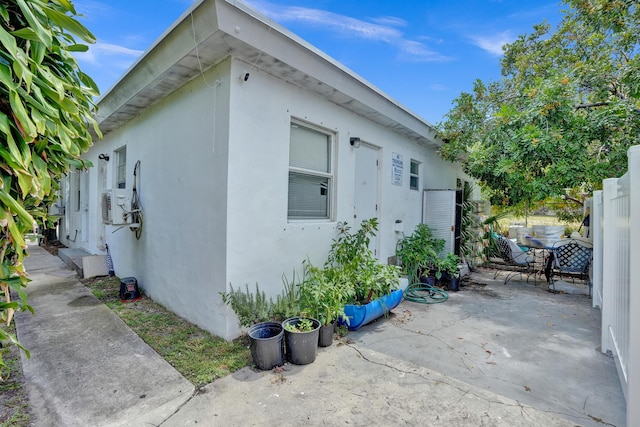 view of side of property featuring a patio