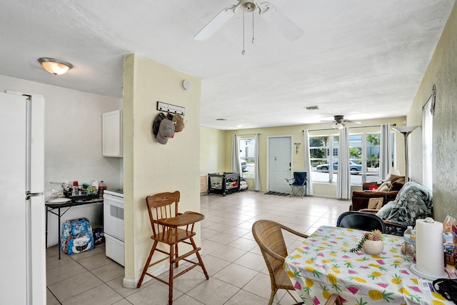 dining area featuring light tile patterned flooring