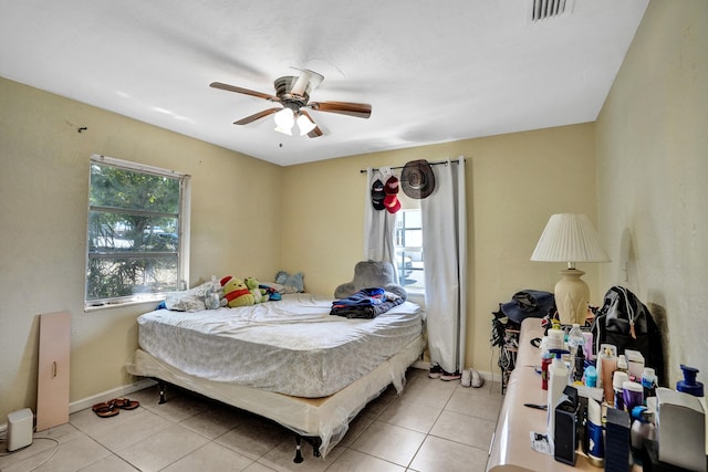 bedroom featuring ceiling fan and light tile patterned floors