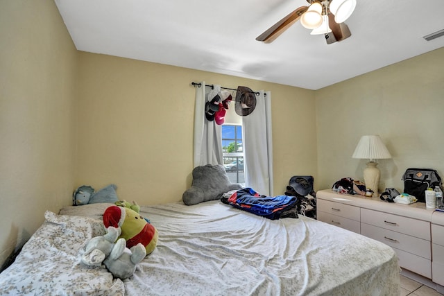 bedroom featuring ceiling fan and light tile patterned flooring