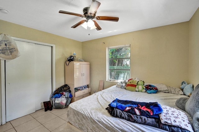 tiled bedroom with ceiling fan