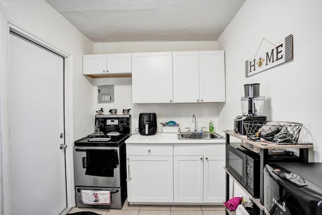 kitchen featuring sink, white cabinets, and stainless steel electric range oven