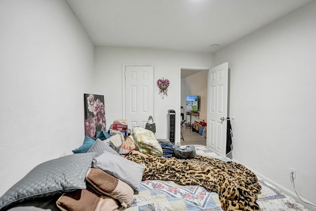 bedroom with light tile patterned floors