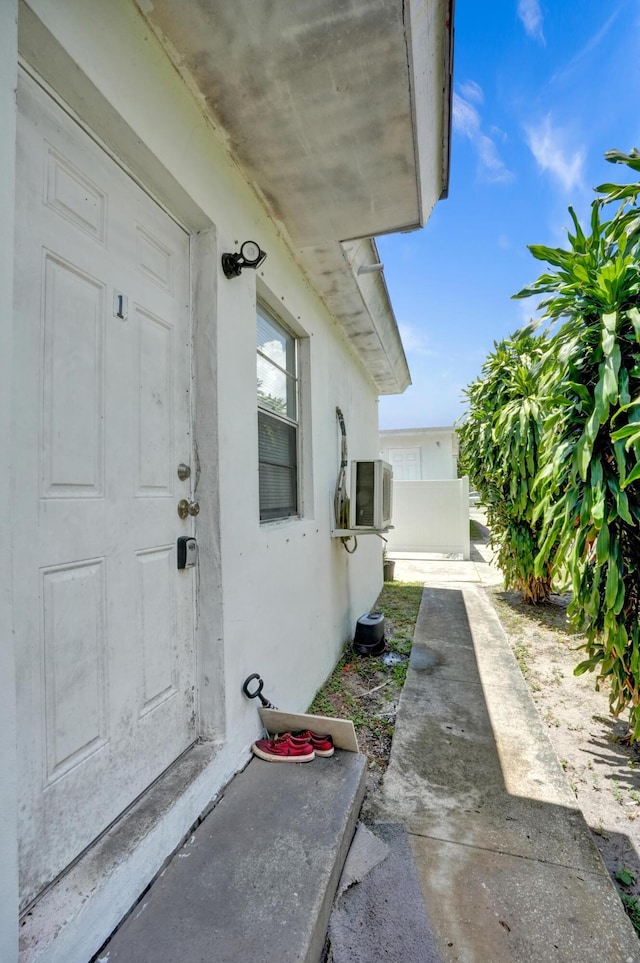 property entrance featuring a patio area