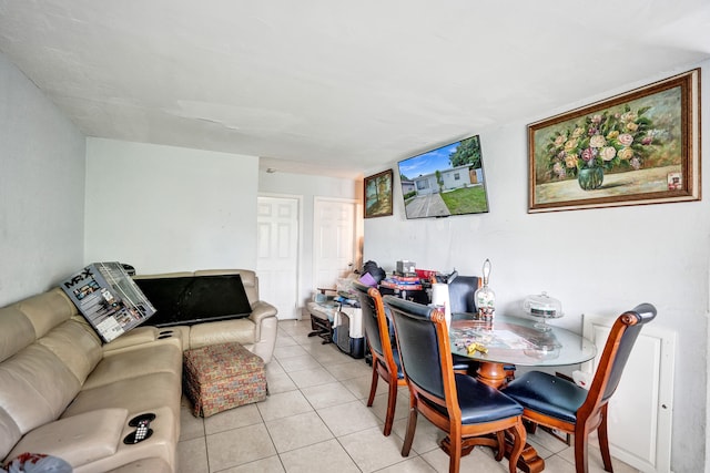 dining space featuring light tile patterned floors