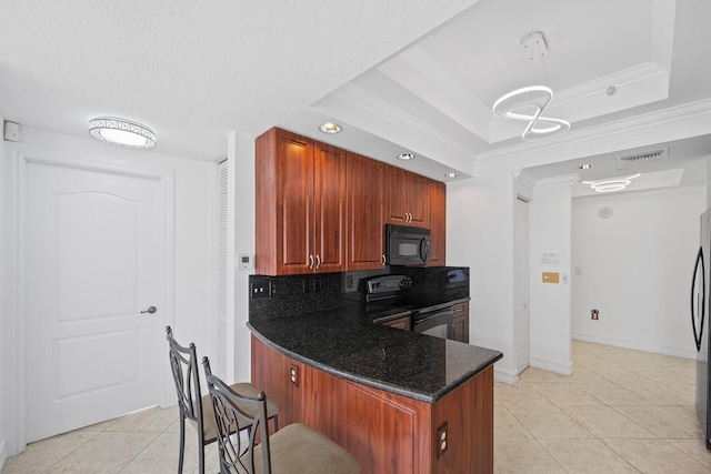 kitchen featuring black appliances, decorative backsplash, a raised ceiling, and crown molding