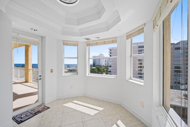 unfurnished sunroom with a tray ceiling