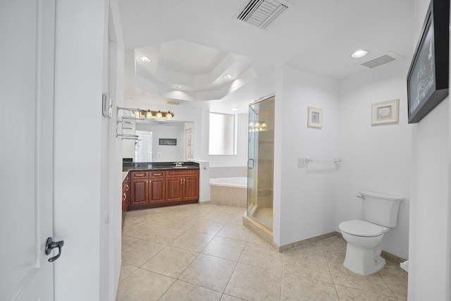 full bathroom with tile patterned flooring, vanity, separate shower and tub, and toilet