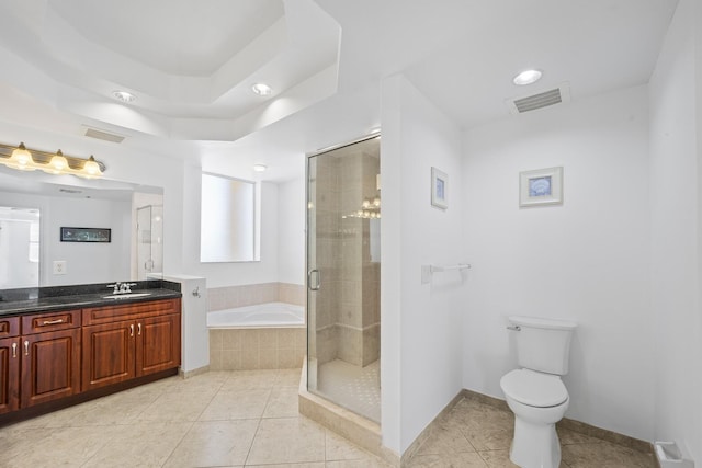 full bathroom with plus walk in shower, vanity, tile patterned flooring, and toilet