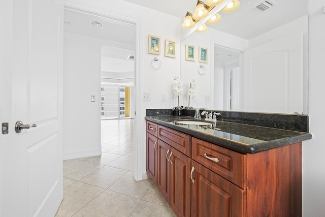 bathroom with tile patterned floors and vanity