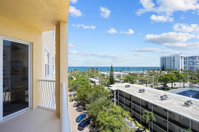 balcony featuring a water view