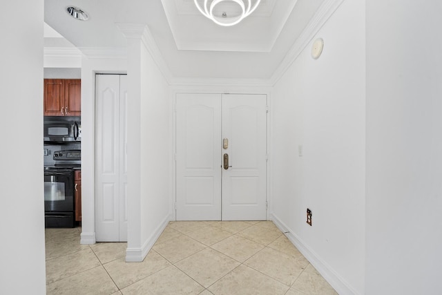 entrance foyer with crown molding and light tile patterned flooring