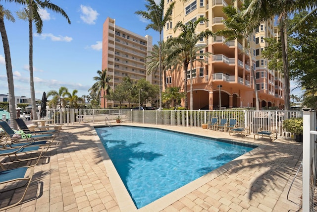 view of swimming pool with a patio area