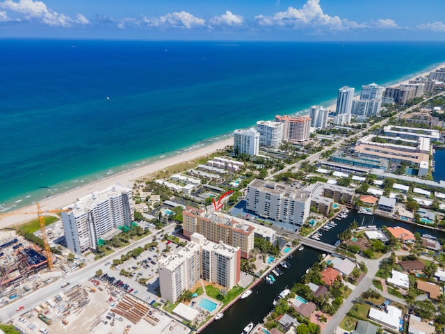 aerial view with a water view and a view of the beach