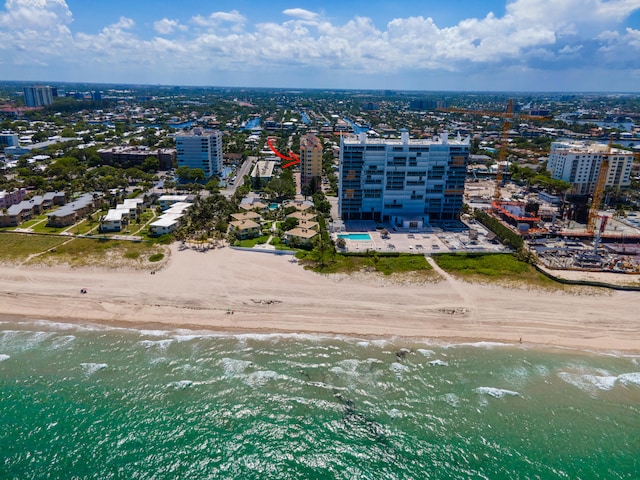 bird's eye view with a view of the beach and a water view