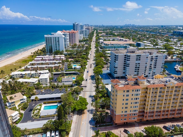 birds eye view of property featuring a view of the beach and a water view