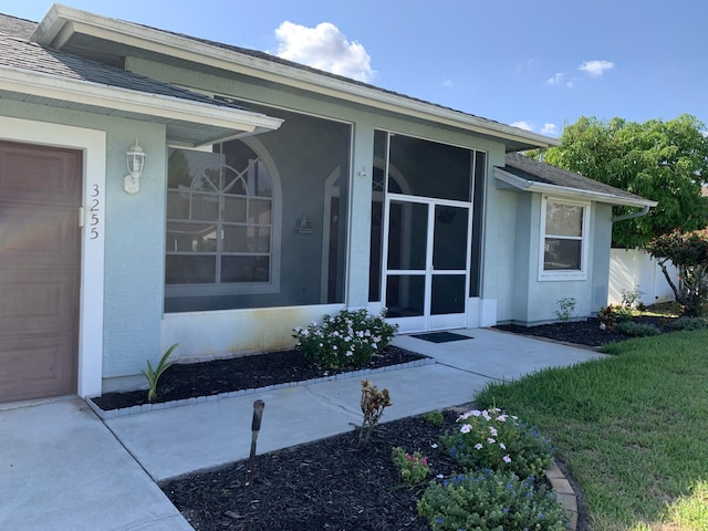 property entrance with a garage