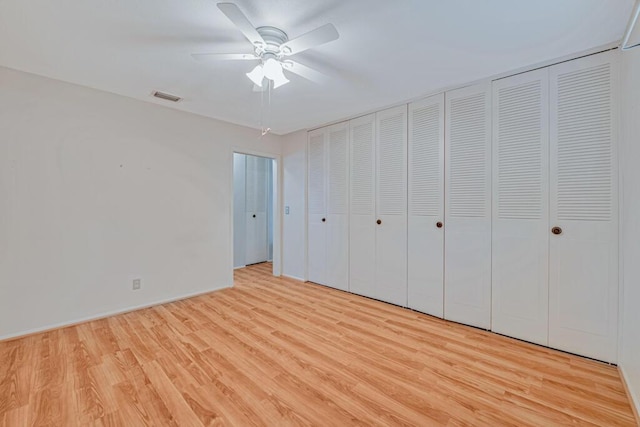 unfurnished bedroom featuring light hardwood / wood-style flooring and ceiling fan