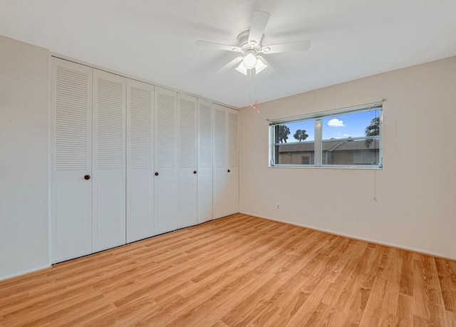 unfurnished bedroom featuring light hardwood / wood-style floors and ceiling fan