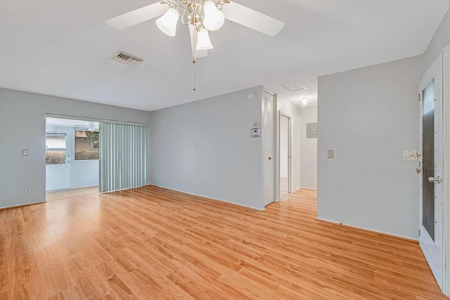 spare room with light wood-type flooring and ceiling fan