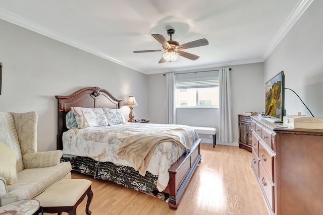 bedroom with light hardwood / wood-style flooring, ceiling fan, and crown molding