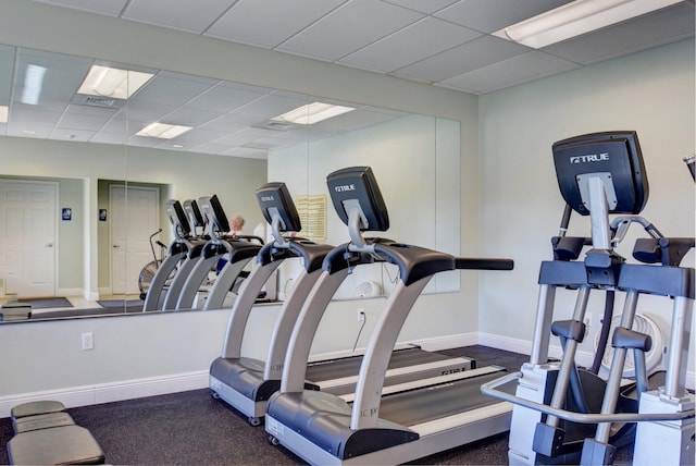 workout area featuring a drop ceiling