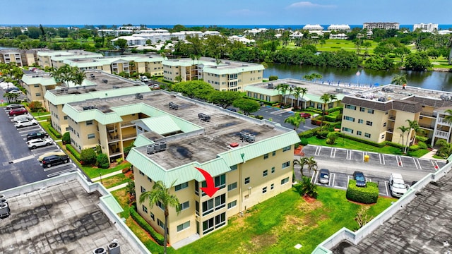 birds eye view of property with a water view