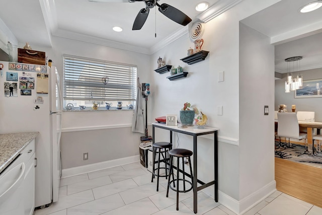 kitchen with ceiling fan with notable chandelier, white refrigerator, a kitchen breakfast bar, ornamental molding, and light wood-type flooring