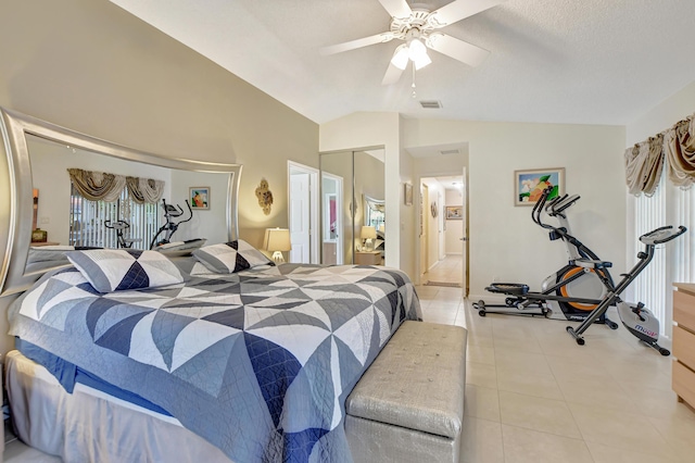 bedroom featuring ceiling fan, lofted ceiling, and a closet