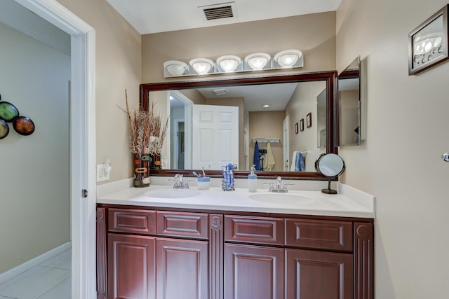 bathroom featuring tile patterned flooring and vanity